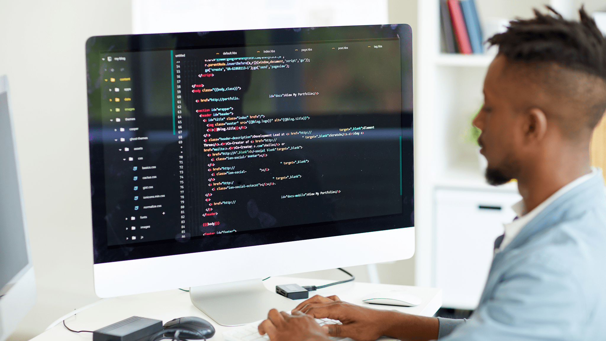 Man working at a computor in computor language