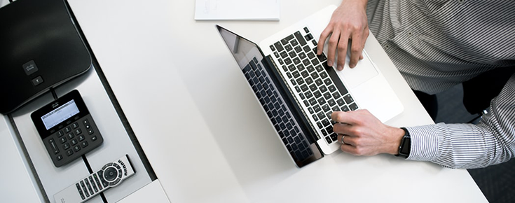 Photography of a person working on a computer